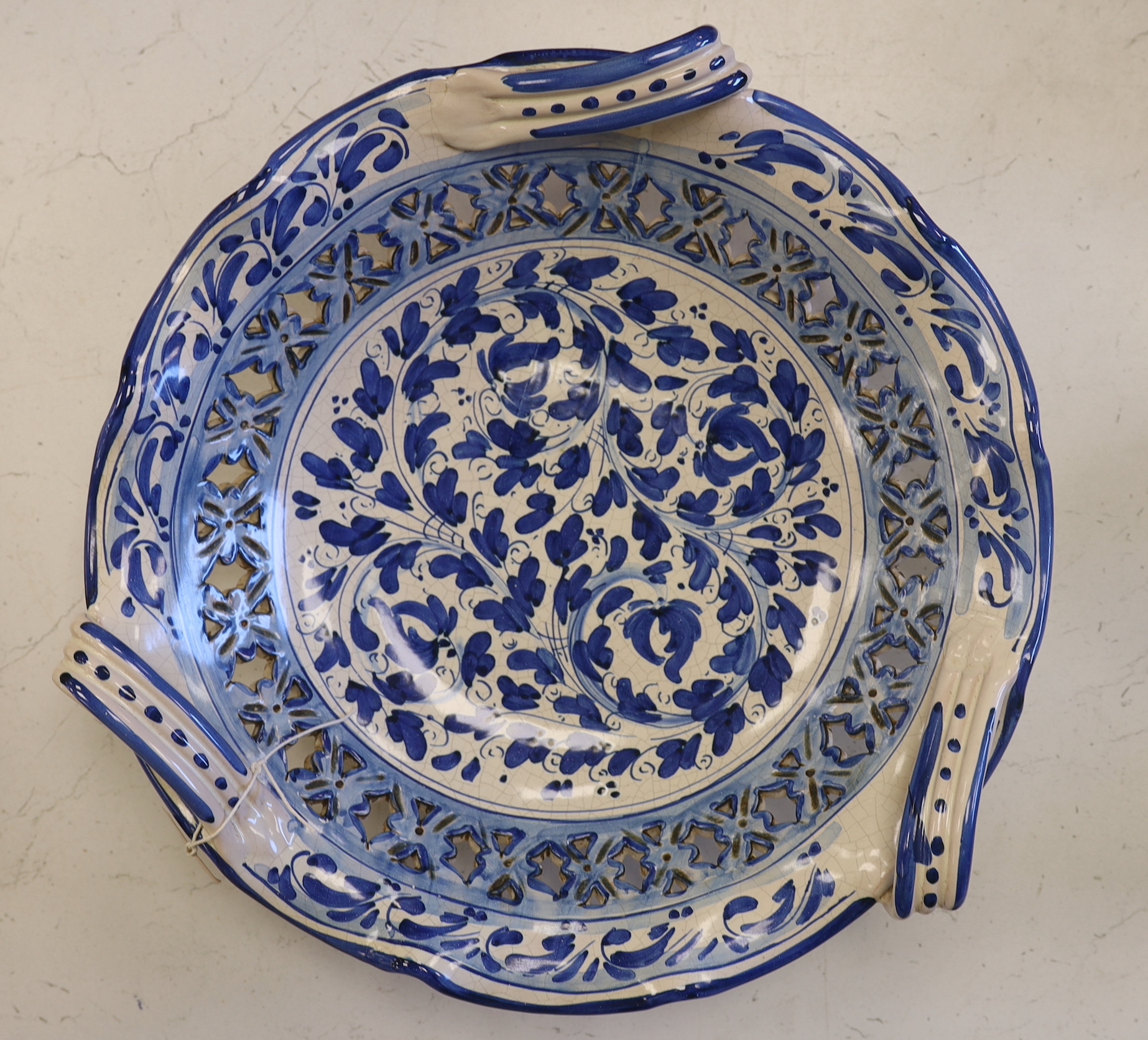 Ernesto Boria, large Italian Caltagirone ceramic blue and white charger, decorated with stylised flowers, signed to the base, 40cm diameter